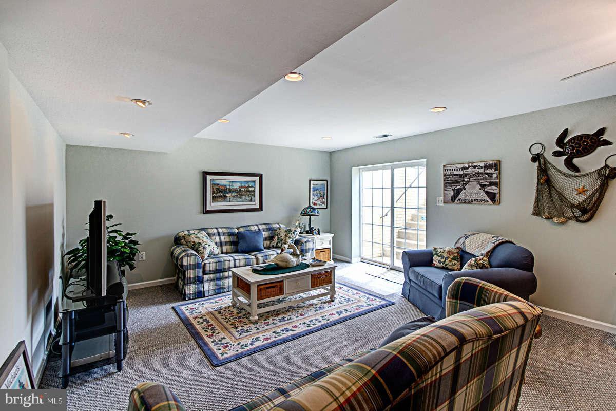 605 Sand Road Severn, MD 21144 - Photo 19 of 30 a living room with furniture and a flat screen tv