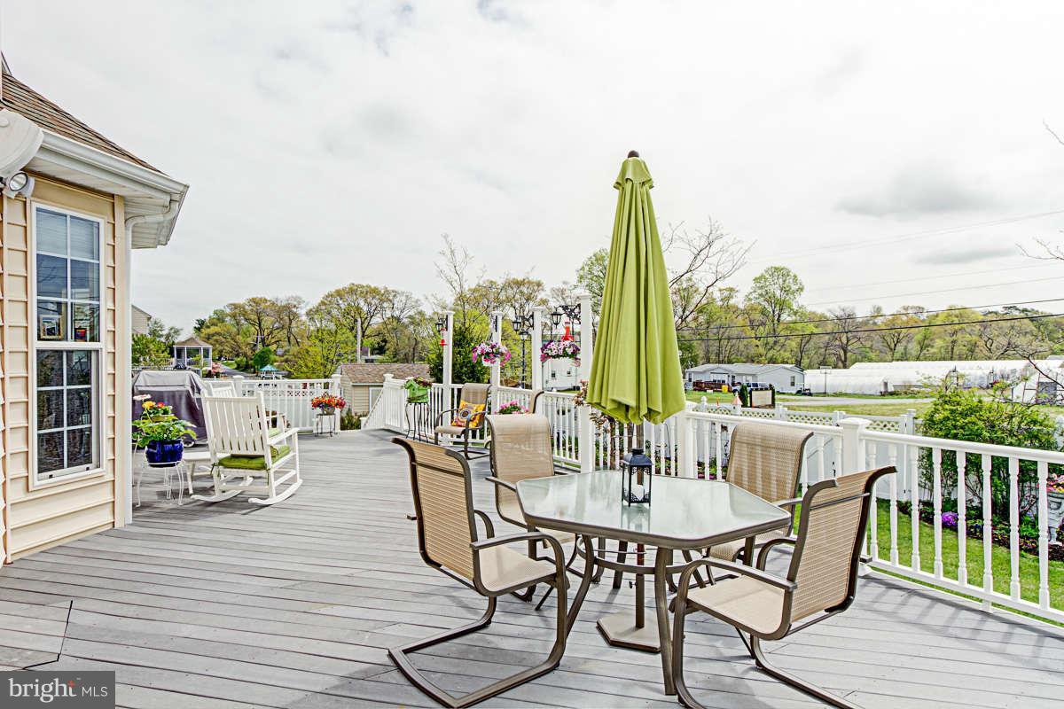605 Sand Road Severn, MD 21144 - Photo 22 of 30 a view of a patio with couches table and chairs
