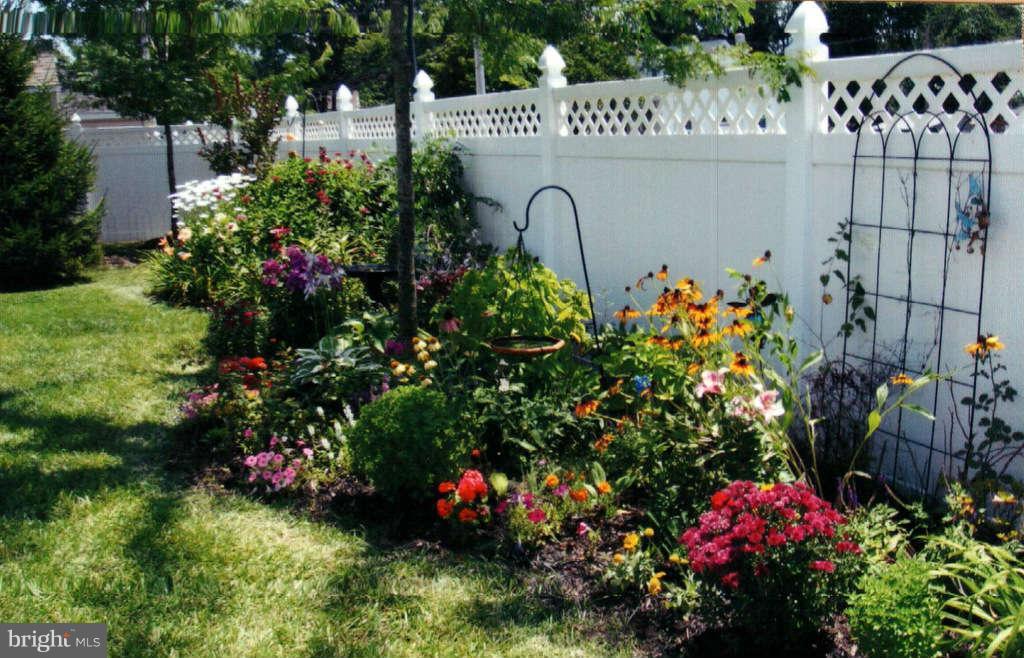 605 Sand Road Severn, MD 21144 - Photo 29 of 30 a sign that is in front of flowers