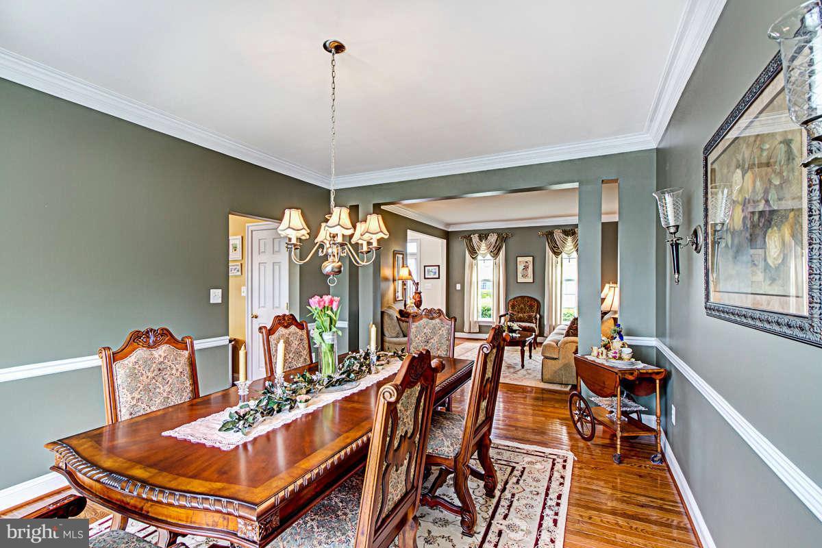 605 Sand Road Severn, MD 21144 - Photo 4 of 30 a view of a dining room with furniture window and outside view