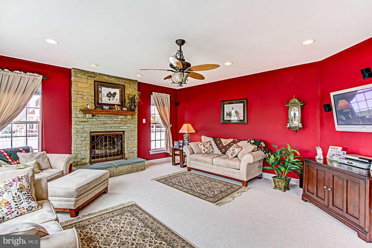 605 Sand Road Severn, MD 21144 - Photo 10 of 30 a living room with furniture and a fireplace