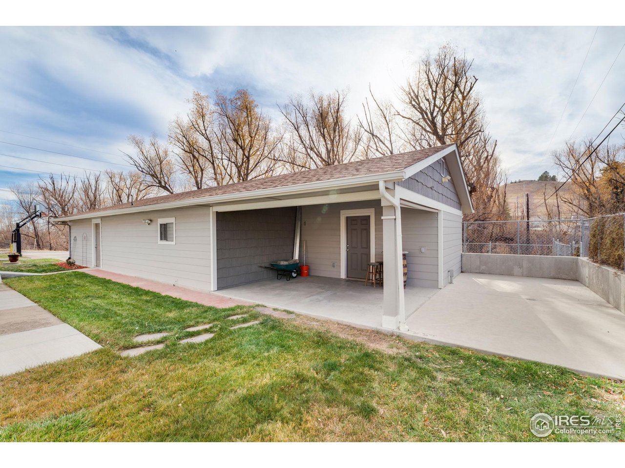 8169 Quaker Street Arvada, CO 80007 - Photo 19 of 20 Heated Exercise/Weight Lifting Room Attached to Garage as Well as Covered Outdoor Living Space