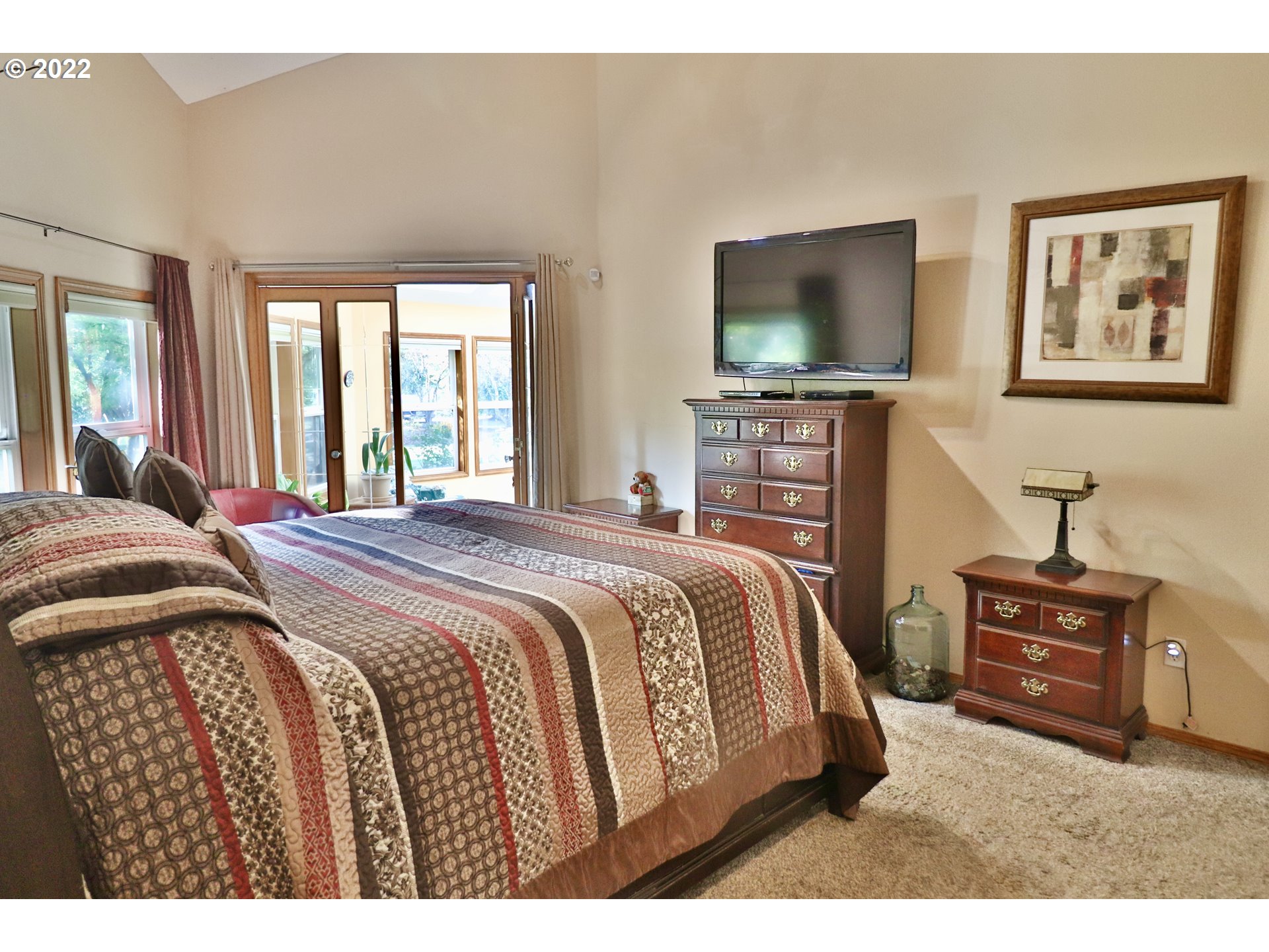 37235 Southeast Lusted Road Boring, OR 97009 - Photo 14 of 30 a bedroom with a bed and a flat screen tv