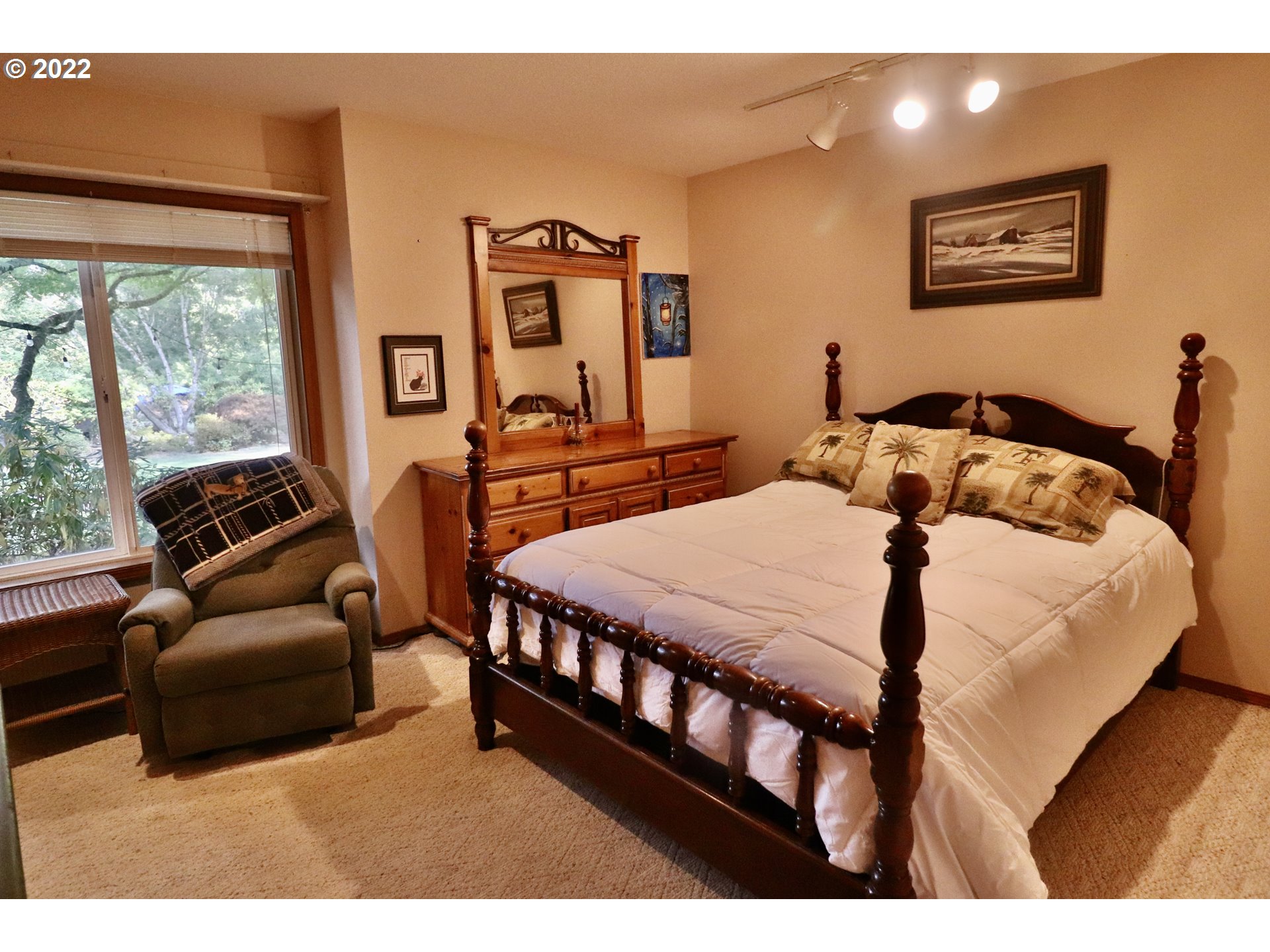 37235 Southeast Lusted Road Boring, OR 97009 - Photo 18 of 30 a bedroom with a bed a couch and a large window