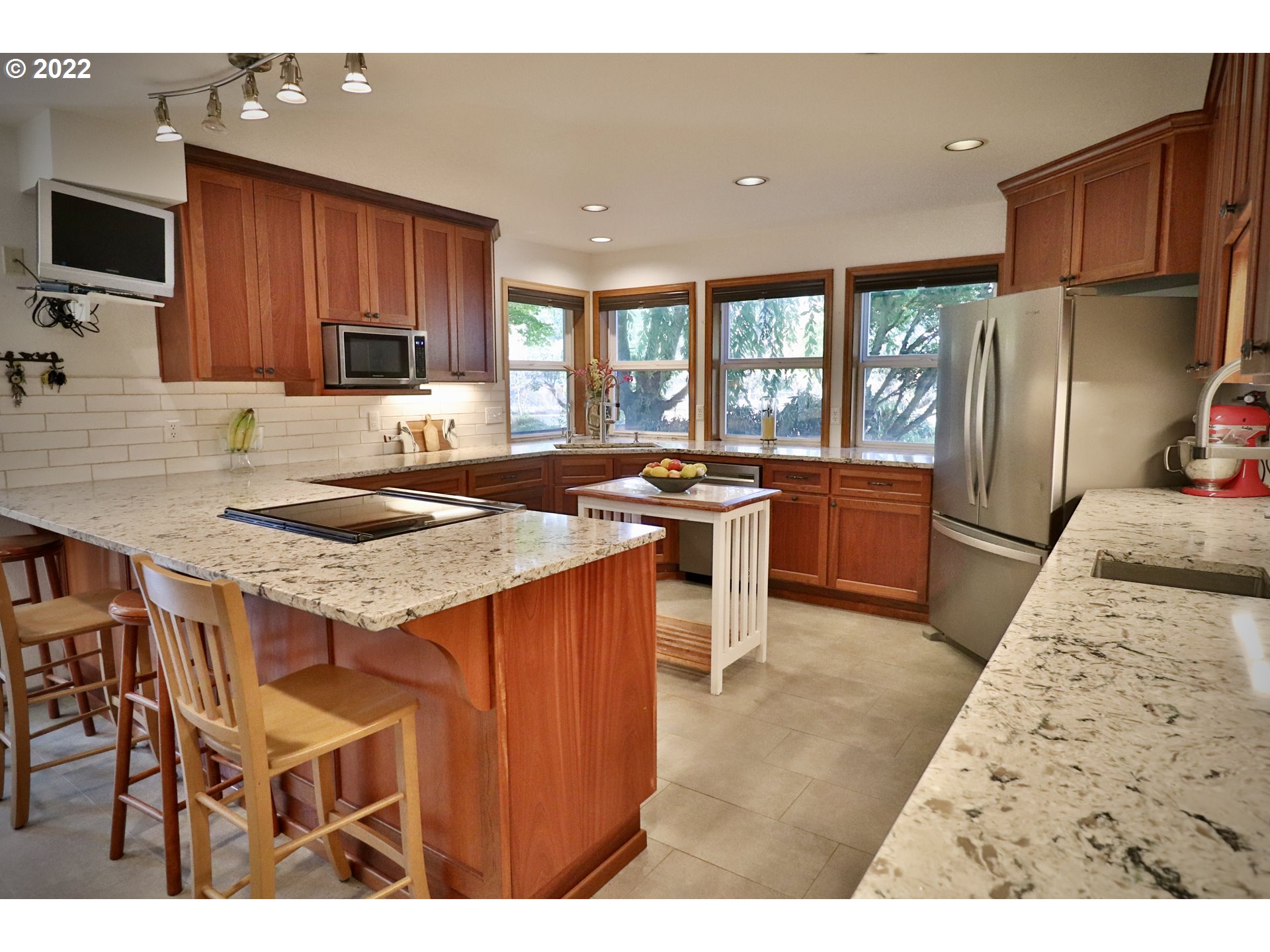 37235 Southeast Lusted Road Boring, OR 97009 - Photo 9 of 30 a kitchen with stainless steel appliances granite countertop a stove a sink a microwave a refrigerator and cabinets