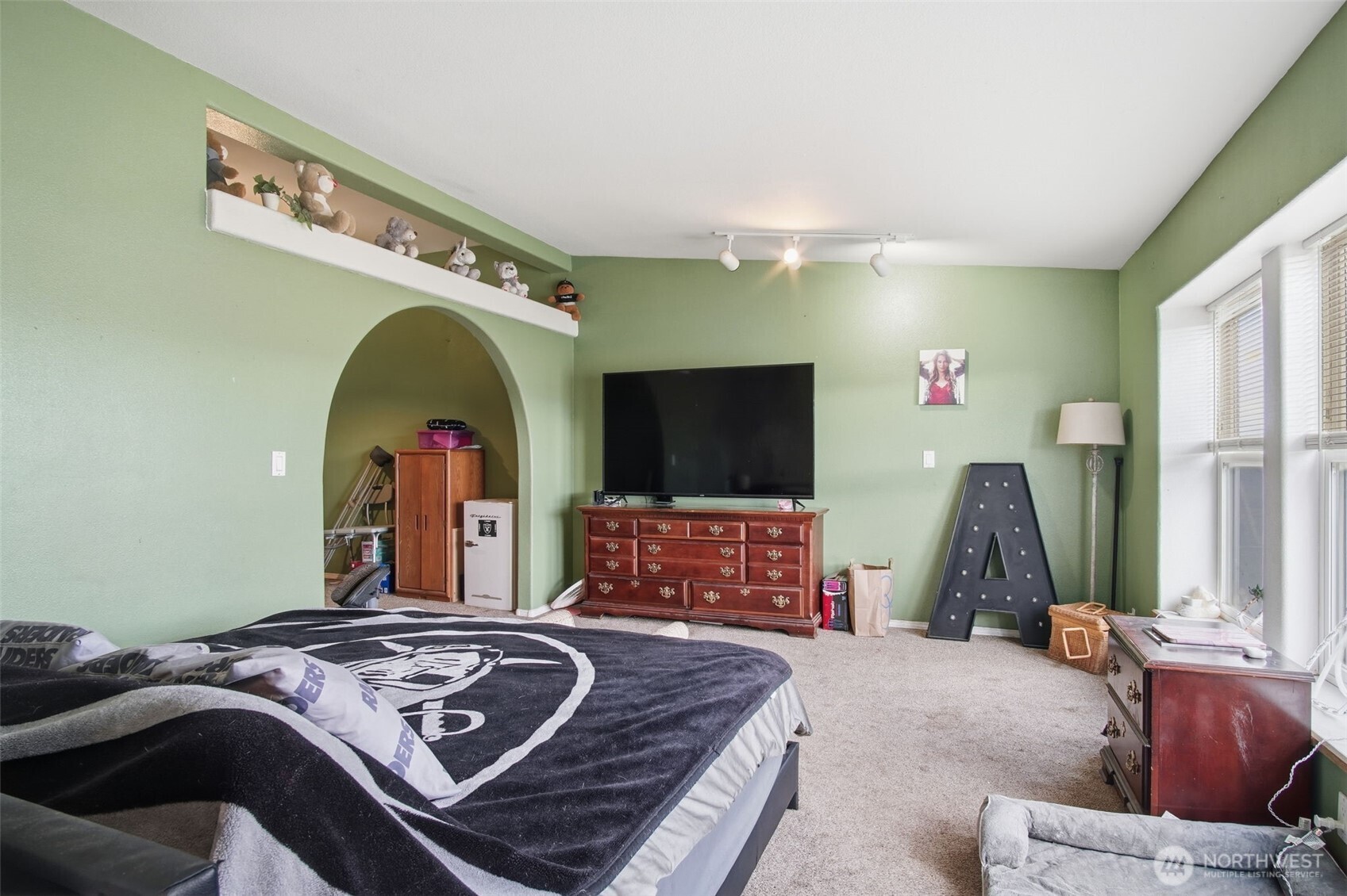 261 Hardy Road Lamont, WA 99017 - Photo 13 of 40 a bedroom with a bed a mirror and dresser