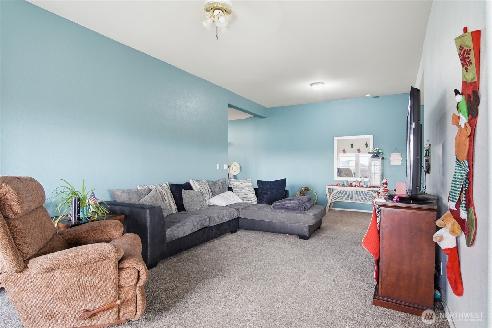 261 Hardy Road Lamont, WA 99017 - Photo 2 of 40 a living room with furniture and a flat screen tv