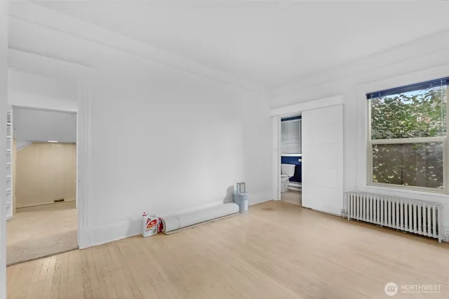 a bathroom with a sink toilet a mirror and shower