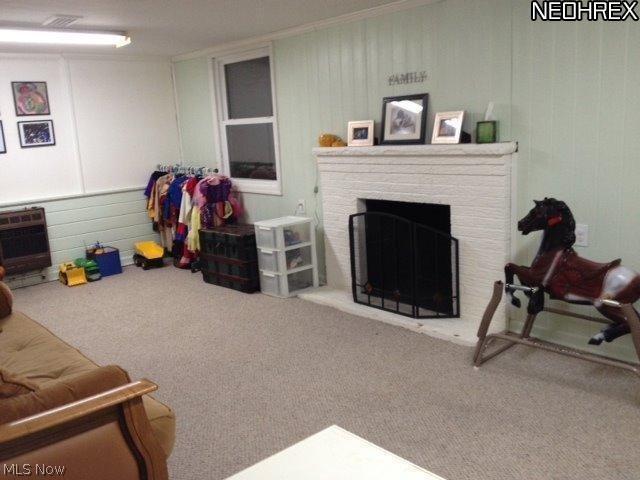3915 Windsor Road Youngstown, OH 44512 - Photo 16 of 24 The large Rec Room with fireplace and built-ins