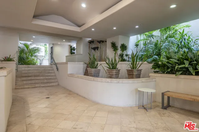 a view of a living room and kitchen