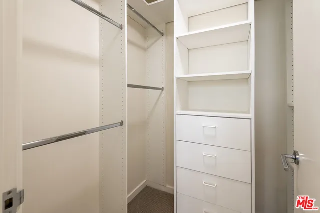 a view of an empty walk in closet
