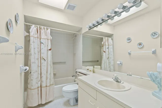 a bathroom with a double vanity sink and mirror