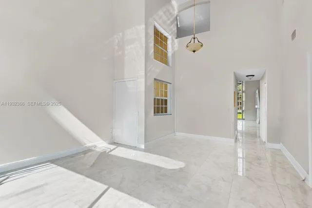 a view of a livingroom with wooden floor and cabinet