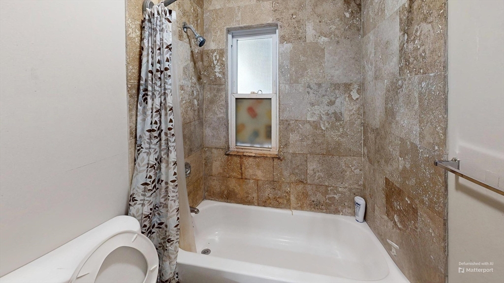 2975 Washington Street, Unit 3 Boston, MA 02119 - Photo 9 of 9 a bathroom with a bathtub and shower