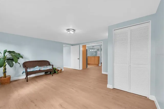 a livingroom with furniture and a potted plant