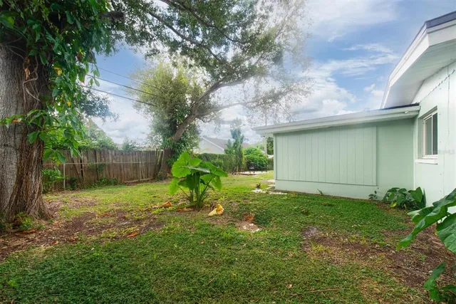 a backyard of a house with lots of green space