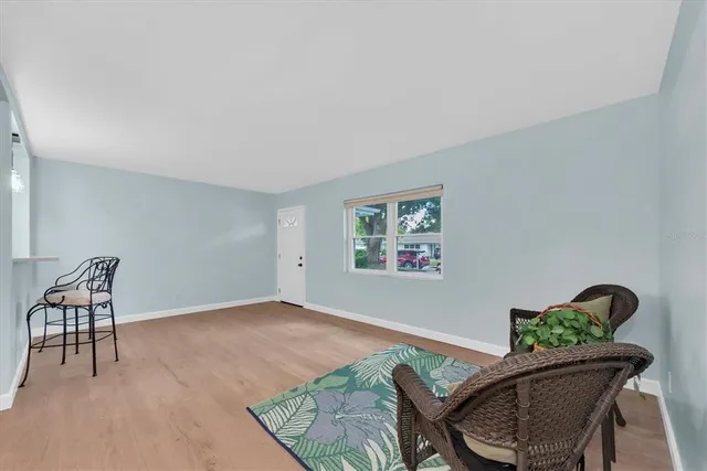 a workspace with furniture and wooden floor