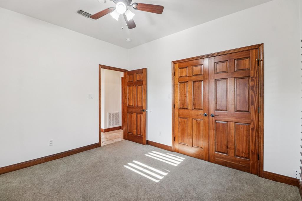 802 Ave C Fredericksburg, TX 78624 - Photo 18 of 22 a view of an empty room with a window