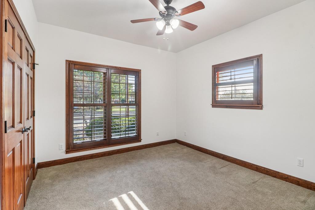 802 Ave C Fredericksburg, TX 78624 - Photo 20 of 22 an empty room with windows and fan