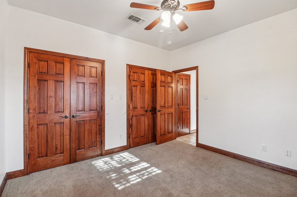 802 Ave C Fredericksburg, TX 78624 - Photo 21 of 22 an empty room with chandelier fan