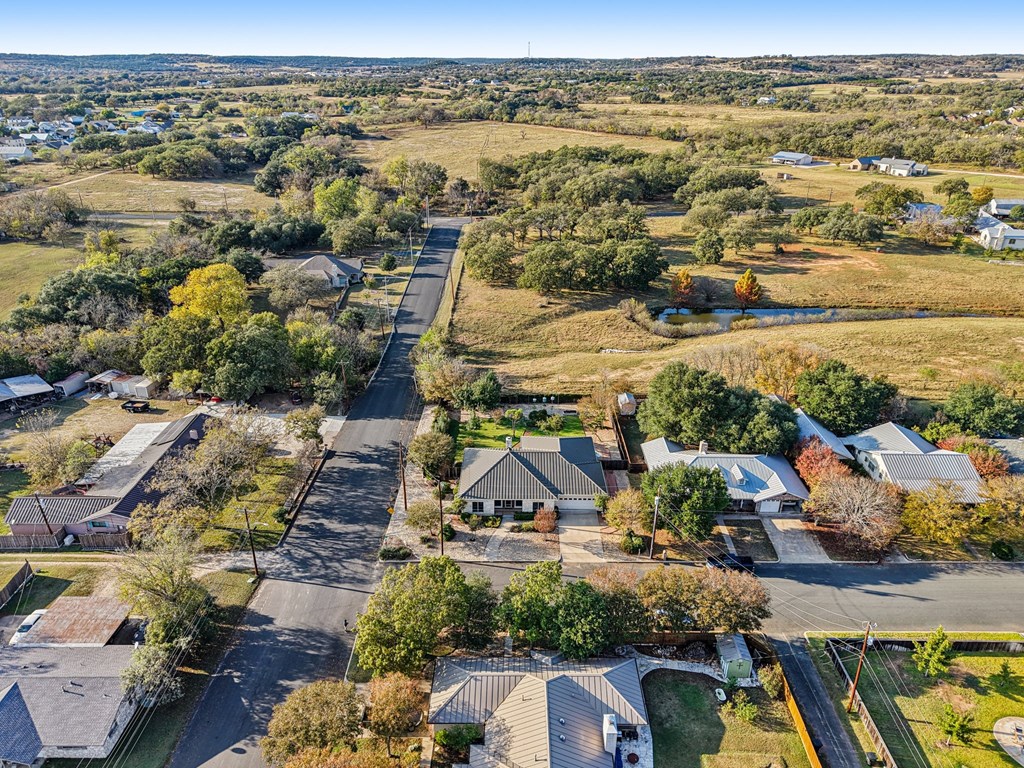 802 Ave C Fredericksburg, TX 78624 - Photo 4 of 22 an aerial view of residential building and lake view