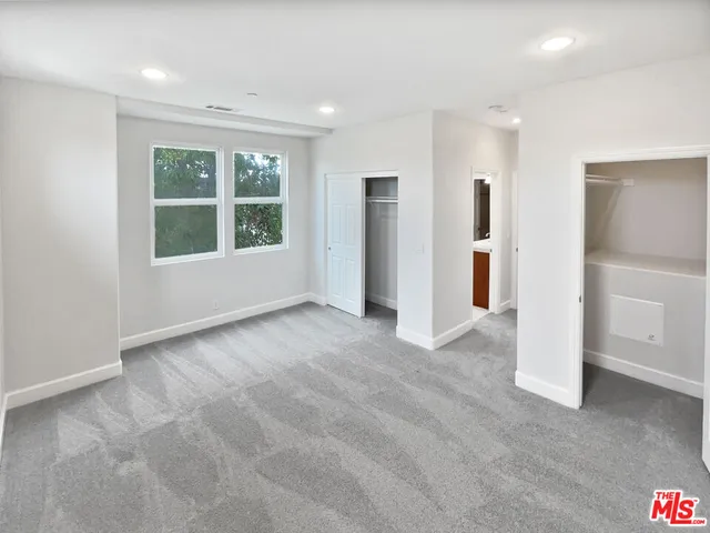 a bathroom with a sink double vanity and a mirror