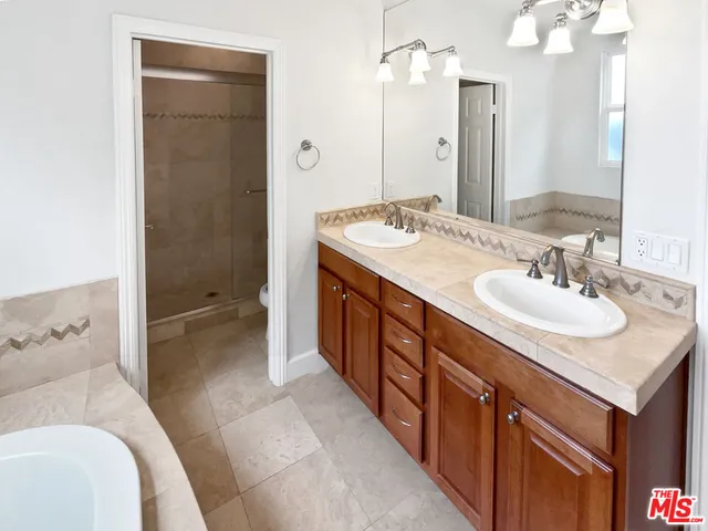 a bathroom with a toilet and shower