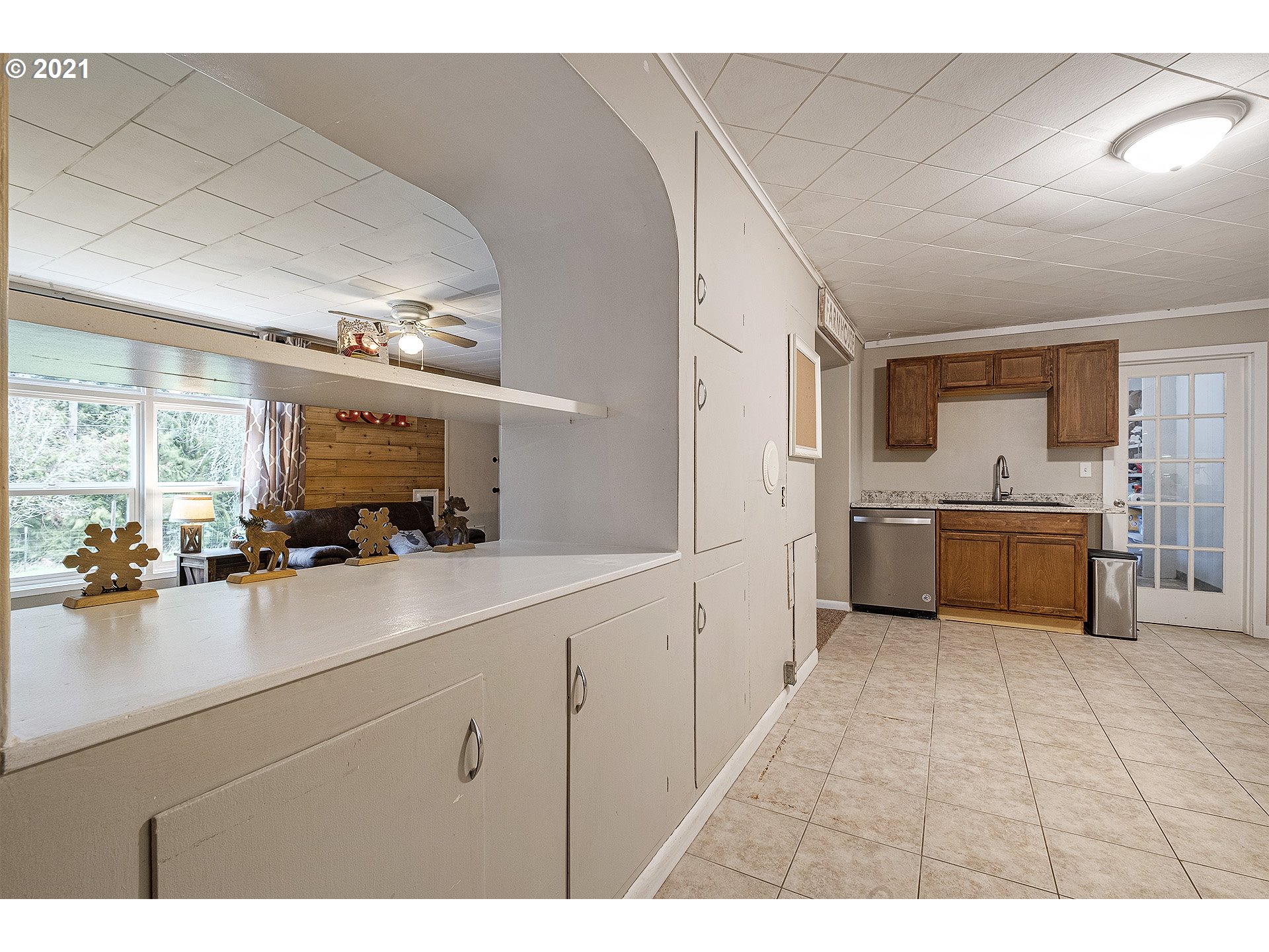 35520 Skogan Road Sandy, OR 97055 - Photo 11 of 25 a kitchen with a sink cabinets and window