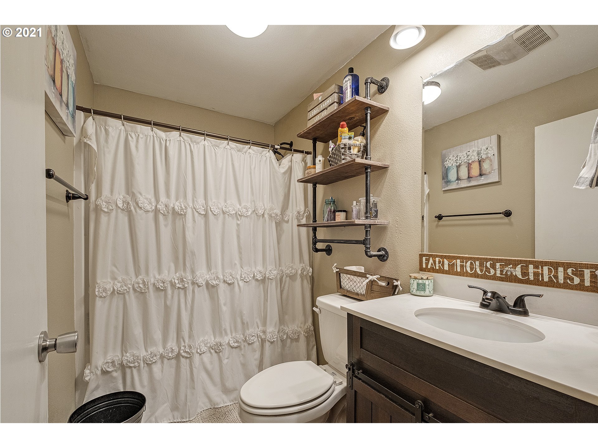 35520 Skogan Road Sandy, OR 97055 - Photo 15 of 25 a bathroom with a sink a toilet a mirror and shower