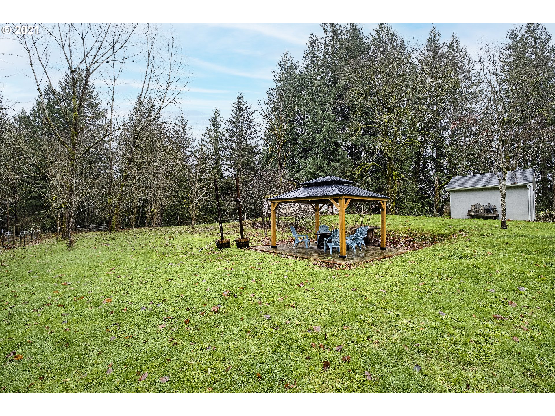 35520 Skogan Road Sandy, OR 97055 - Photo 17 of 25 a view of a house with backyard and sitting area