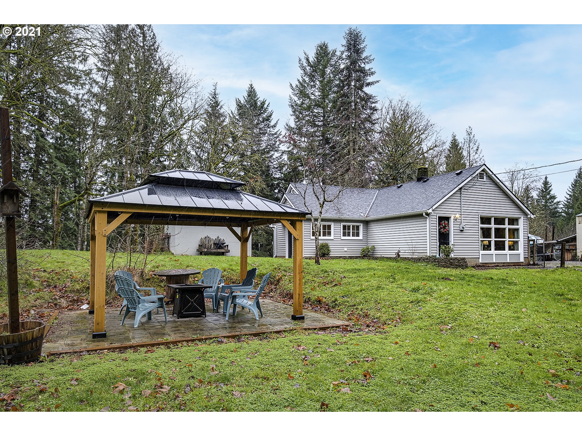 35520 Skogan Road Sandy, OR 97055 - Photo 3 of 25 a view of a house with yard and a garden