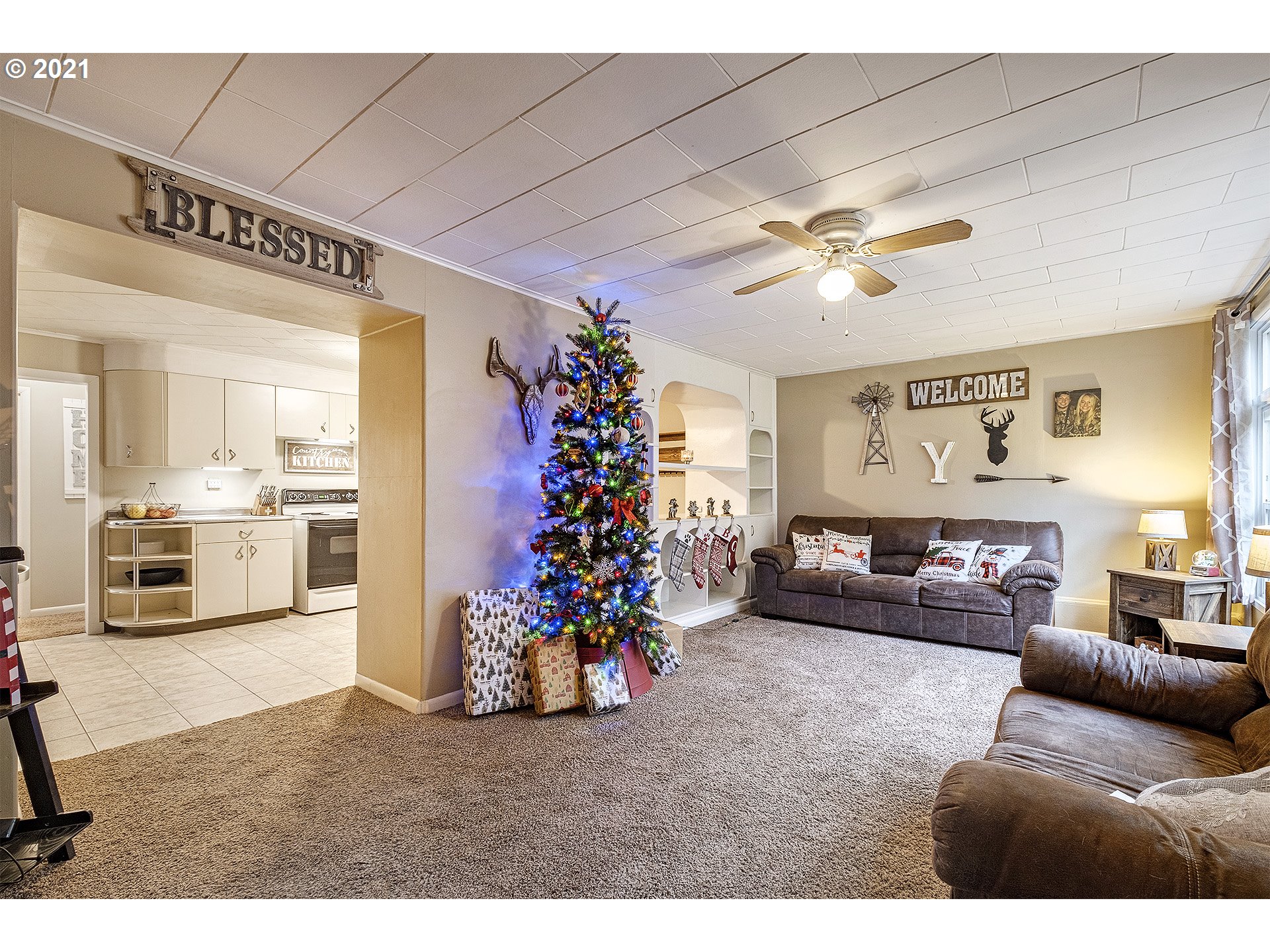35520 Skogan Road Sandy, OR 97055 - Photo 5 of 25 a living room with furniture and a chandelier