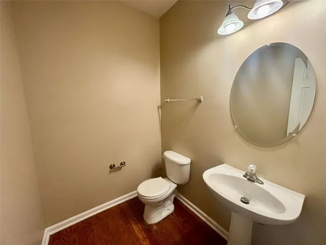 a bathroom with a toilet and a sink