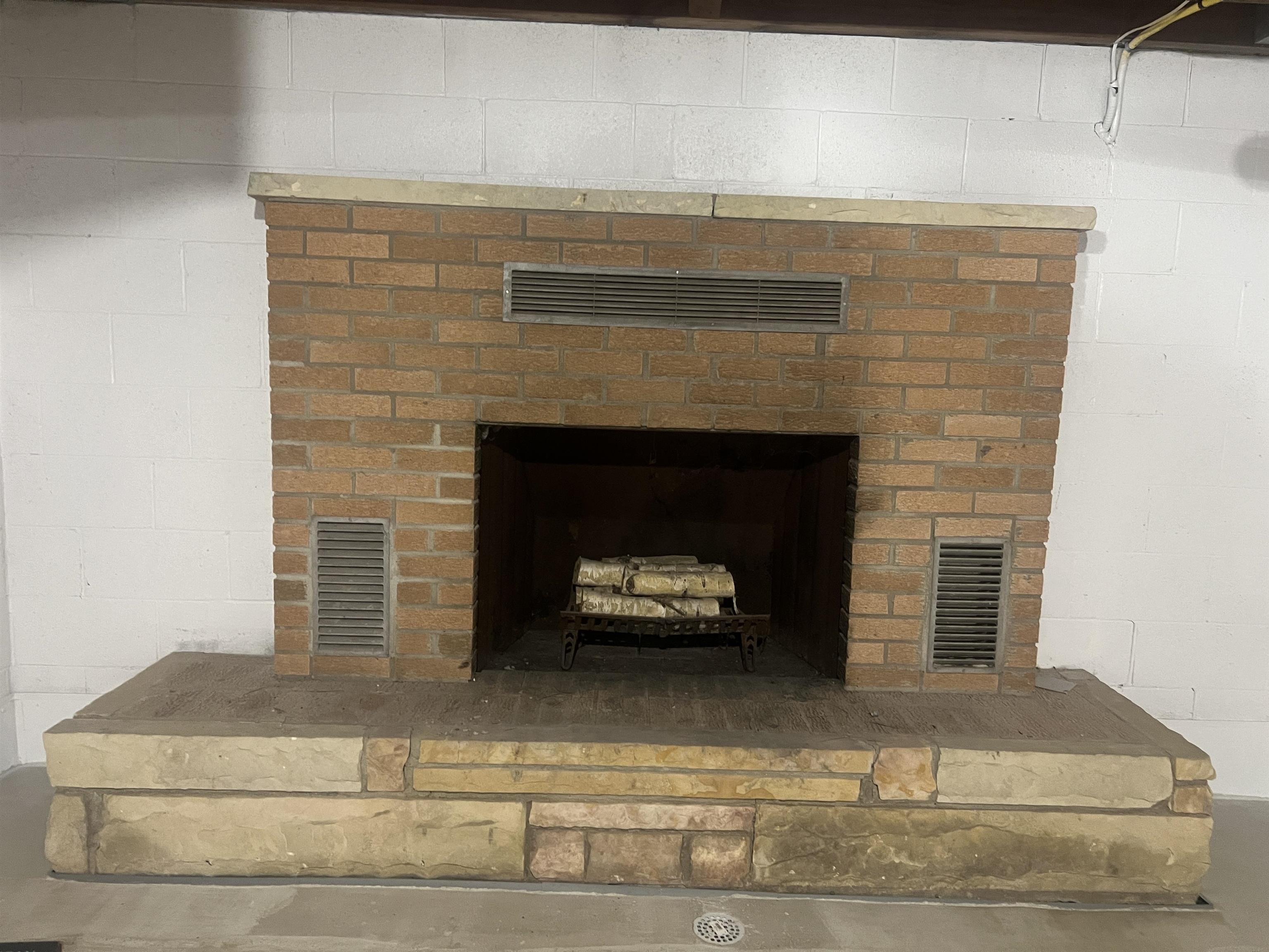 8921 North Mission Road Clare, MI 48617 - Photo 32 of 51 Lower level fireplace