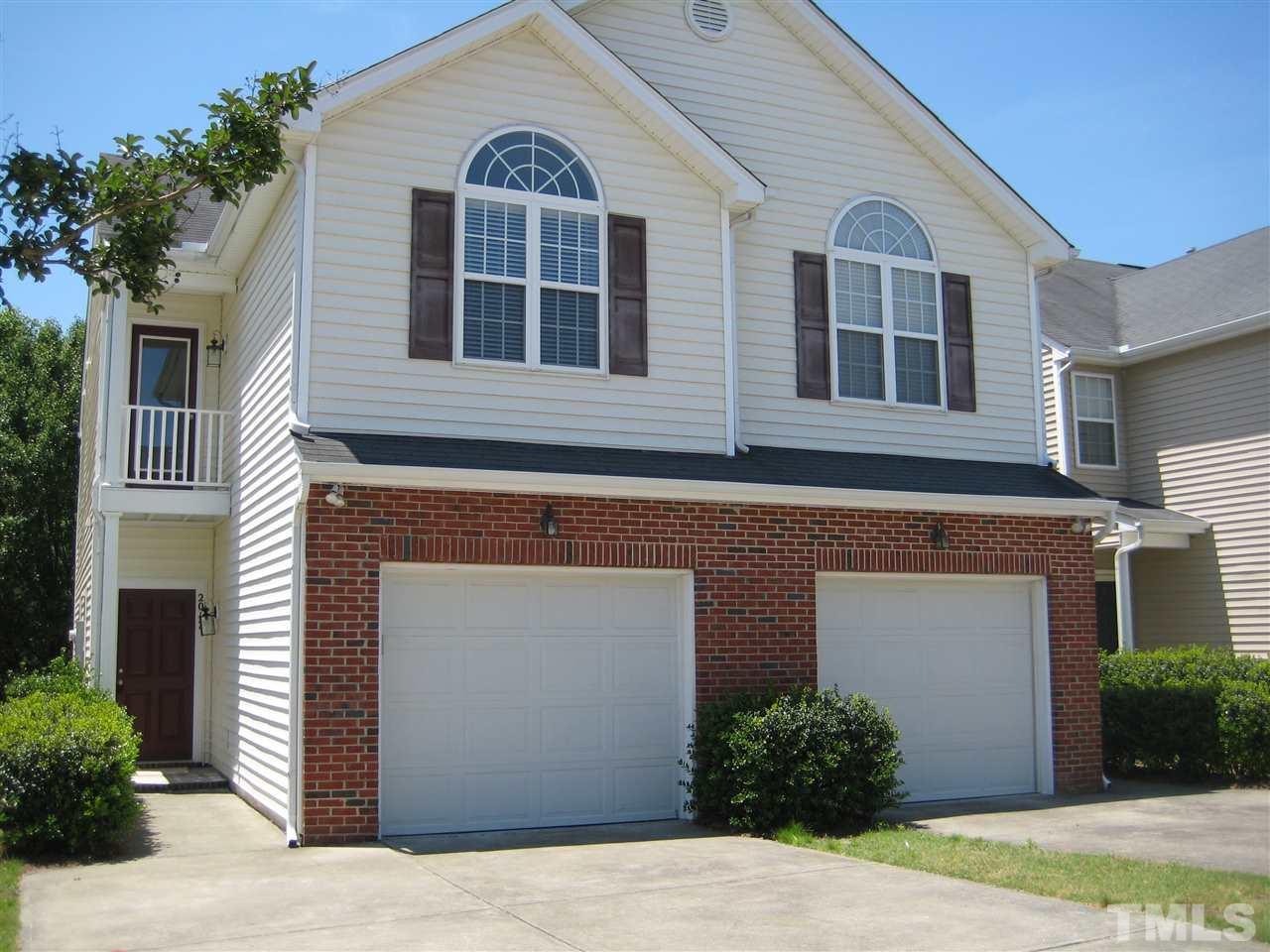 2017 Metacomet Way Raleigh, NC 27604 - Photo 2 of 15 a front view of a house with a yard and garage