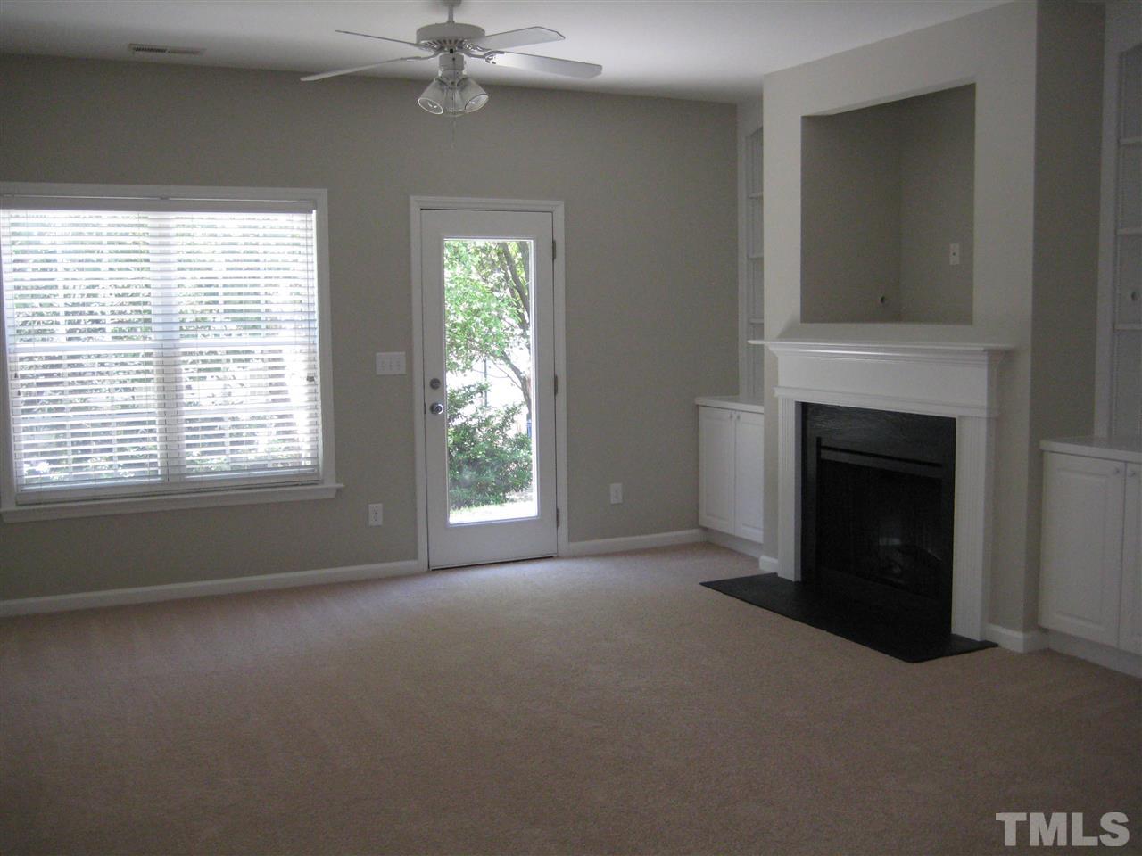 2017 Metacomet Way Raleigh, NC 27604 - Photo 6 of 15 a view of empty room with window and fireplace