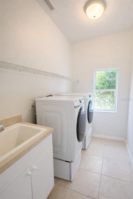 2009 Meadow Rue Court Trinity, FL 34655 - Photo 14 of 21 a utility room with dryer and washer
