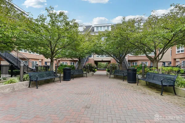 a view of a patio with table and chairs and potted plants