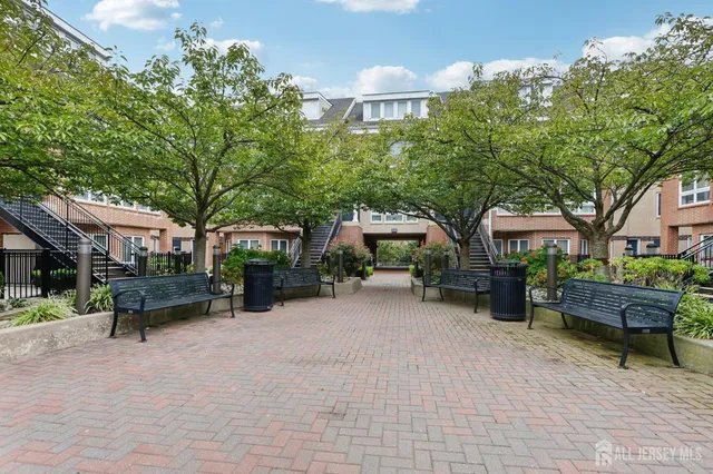 a view of a patio with table and chairs and potted plants