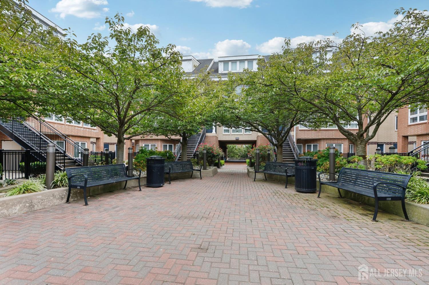 a view of a patio with table and chairs and potted plants