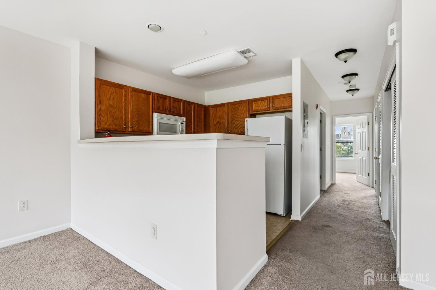 368 Rector Street, Unit 421 Perth Amboy, NJ 08861 - Photo 15 of 37 a view of a livingroom with a kitchen