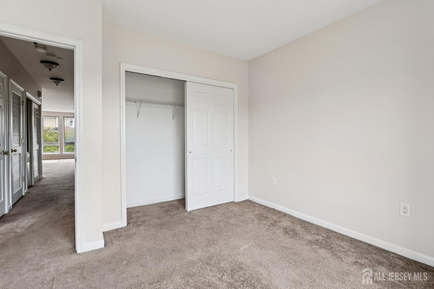 368 Rector Street, Unit 421 Perth Amboy, NJ 08861 - Photo 21 of 37 an empty room with windows