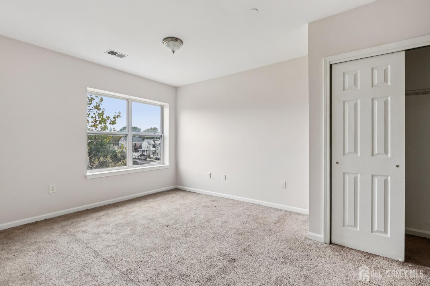 368 Rector Street, Unit 421 Perth Amboy, NJ 08861 - Photo 22 of 37 a view of an empty room with a window