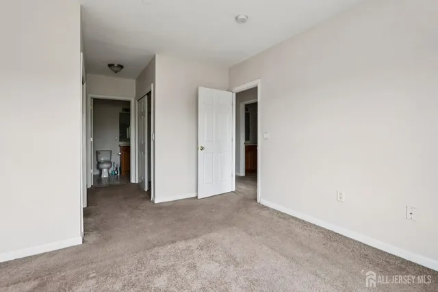 a view of an empty room and closet