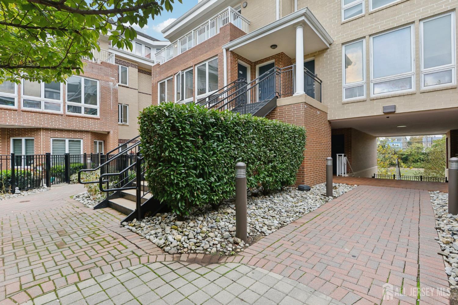 368 Rector Street, Unit 421 Perth Amboy, NJ 08861 - Photo 3 of 37 a view of a building with a bench