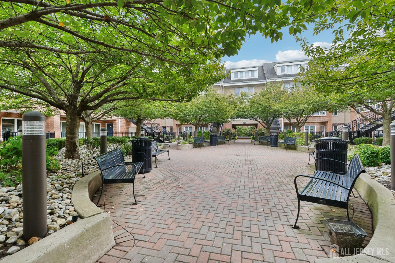 368 Rector Street, Unit 421 Perth Amboy, NJ 08861 - Photo 4 of 37 a view of a patio with couches table and chairs and potted plants