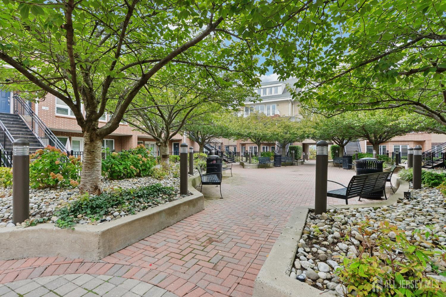368 Rector Street, Unit 421 Perth Amboy, NJ 08861 - Photo 6 of 37 a view of a patio with a table and chairs and potted plants