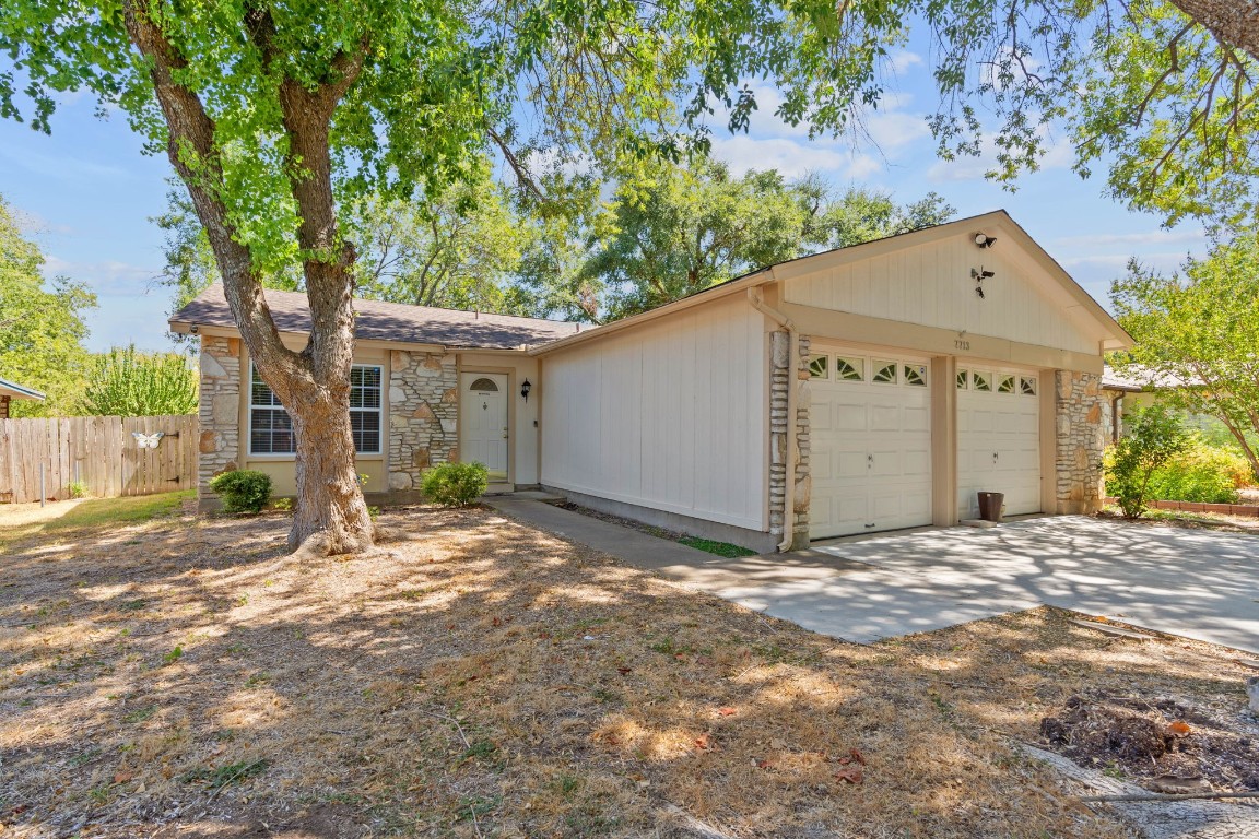 7713 Elderberry Drive Austin, TX 78745 - Photo 1 of 1 a view of a house with a tree in front of it