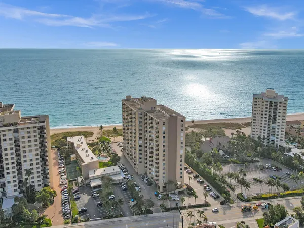 a view of ocean with a multi story building