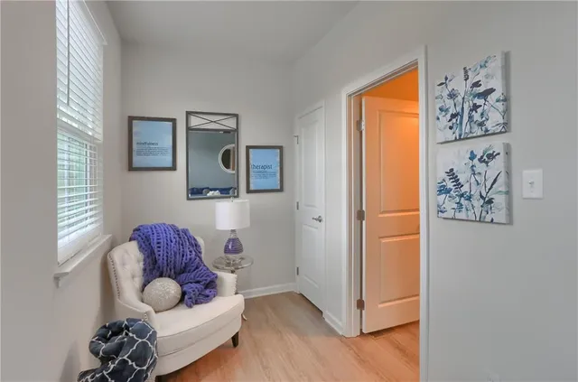 a living room with furniture and a window